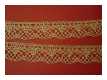 Feine Spitze in Gold